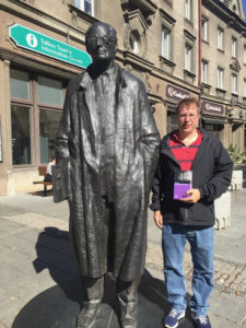 Larger than life statue of Jaan Kross; next to that Doug Merrill holding a copy of Kross' book Der Verrückte des Zaren