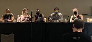 Photo shows participants in the Neon Hemlock Reading Showcase at FlameCon 2025 described in accompanying text