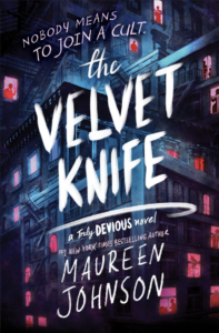the cover of The Velvet Knife by Maureen Johnson has the title in all caps against the background of an apartment building with lit windows